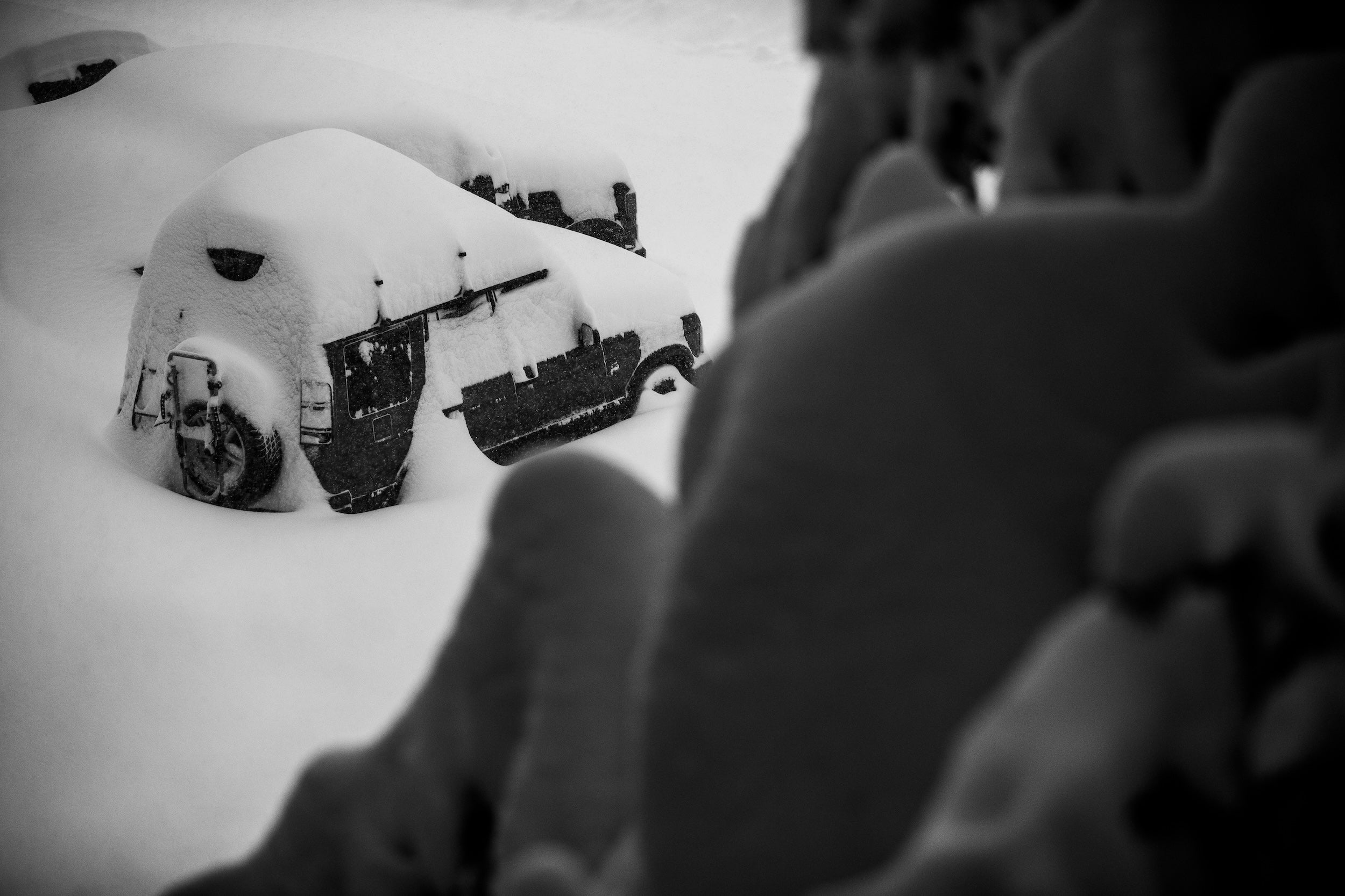 Snowy car with a snowy landscape in the background